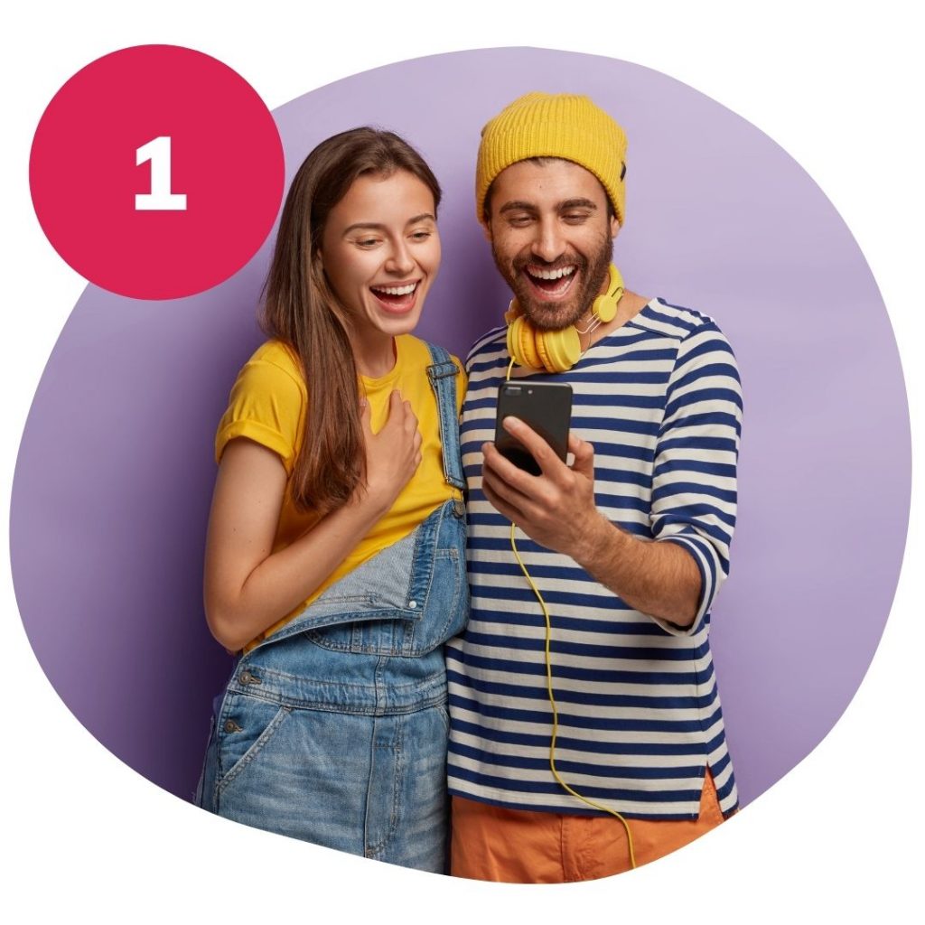 Couple looking at a phone and smiling