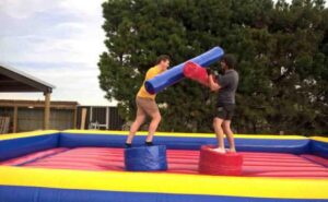 Inflatable gladiator challenge stag party activity