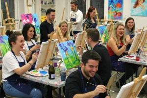 A group of adults taking part in a paint and prosecco class